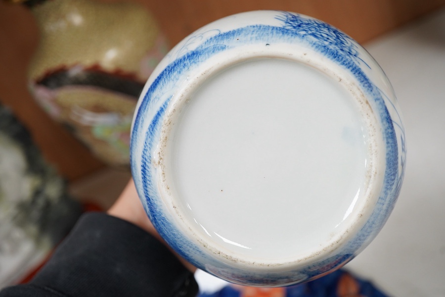 A Japanese Imari dish an Arita bottle vase together with a Chinese cloisonné enamel vase and a Chinese hardstone boulder carving, largest 34cm in diameter